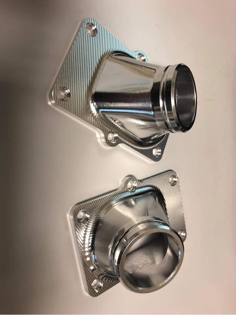 Pair of finished machined aluminium intake elbows